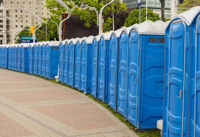 a line of brightly-colored portable restrooms, perfect for outdoor festivals and concerts in Arcadia CA